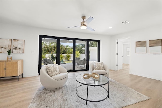 3801 Dr Martin Luther King Jr St N, Saint Petersburg, FL 33703 - living area featuring light wood-style flooring, baseboards, a ceiling fan, and recessed lighting
