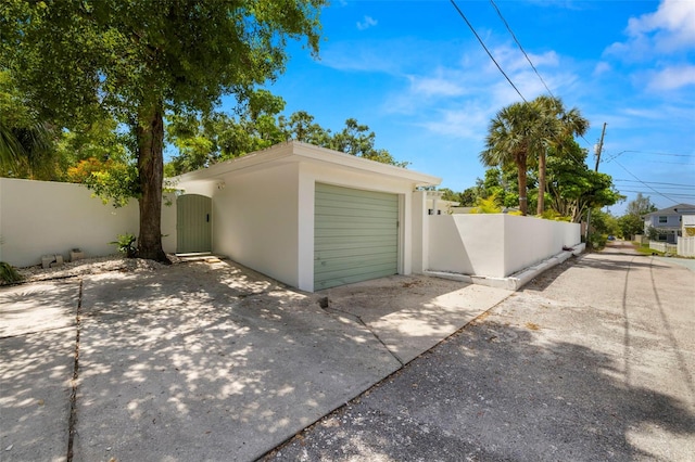 3801 Dr Martin Luther King Jr St N, Saint Petersburg, FL 33703 - garage with a gate, fence, and driveway