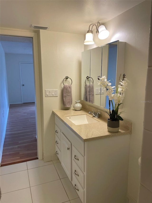 210 Cypress Ct Unit 122, Oldsmar, FL 34677 - bathroom featuring tile patterned floors, vanity, and baseboards