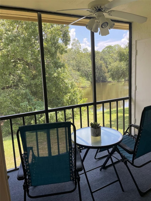 210 Cypress Ct Unit 122, Oldsmar, FL 34677 - balcony featuring a ceiling fan and a water view