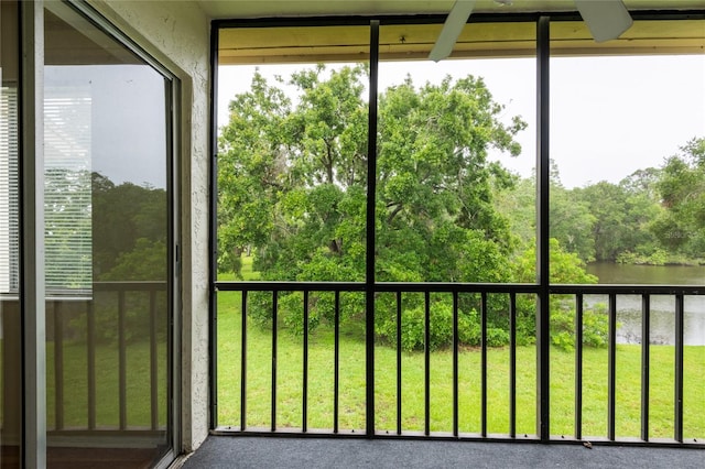 210 Cypress Ct Unit 122, Oldsmar, FL 34677 - unfurnished sunroom featuring healthy amount of natural light and a water view