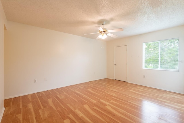 210 Cypress Ct Unit 122, Oldsmar, FL 34677 - unfurnished room featuring light wood-type flooring, a textured ceiling, and a ceiling fan