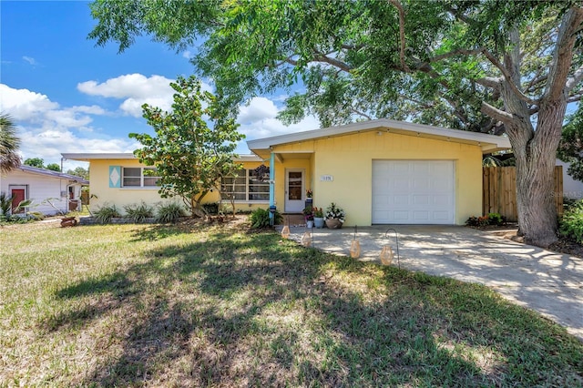 11376 119th Ter, Largo, FL 33778 - ranch-style home featuring a garage, stucco siding, and concrete driveway