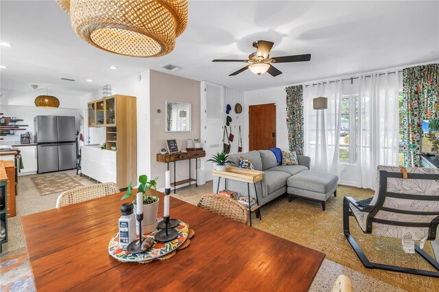 11376 119th Ter, Largo, FL 33778 - living room with ceiling fan, recessed lighting, and a chandelier