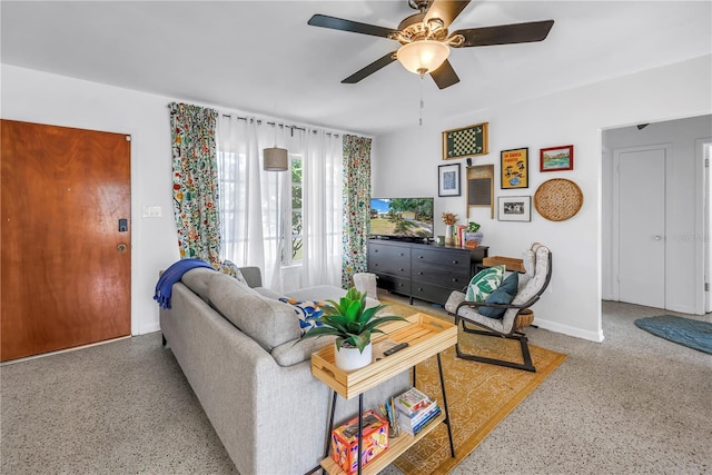 11376 119th Ter, Largo, FL 33778 - living room featuring speckle patterned floor, ceiling fan, and baseboards
