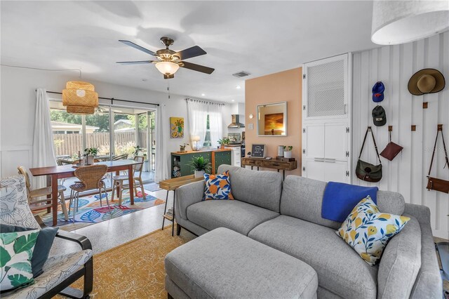 11376 119th Ter, Largo, FL 33778 - living area with speckle patterned floor and a ceiling fan