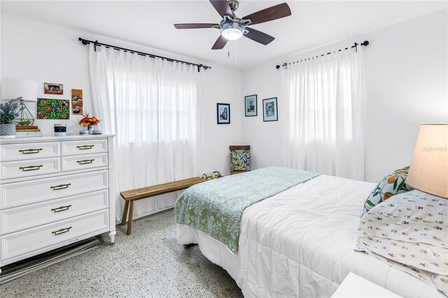 11376 119th Ter, Largo, FL 33778 - bedroom featuring dark aggregate flooring and ceiling fan