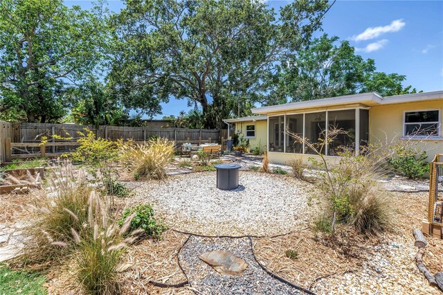 11376 119th Ter, Largo, FL 33778 - view of yard with a sunroom, fence, and a patio