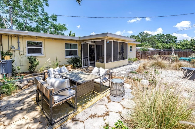 11376 119th Ter, Largo, FL 33778 - rear view of house featuring fence, a sunroom, a patio area, and stucco siding
