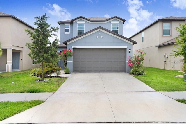 traditional home featuring stucco siding, concrete driveway, and a front lawn
