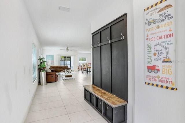 mudroom featuring light tile patterned flooring and a ceiling fan
