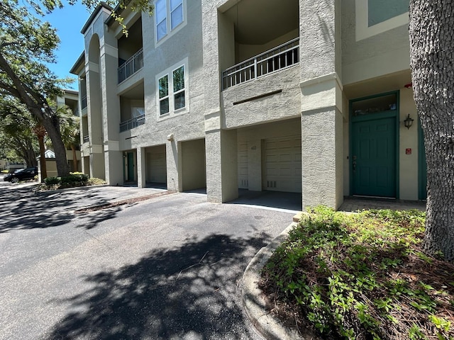 622 Seascape Way, Tampa, FL 33602 - view of building exterior with an attached garage and driveway
