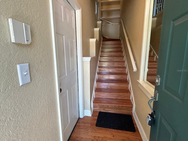622 Seascape Way, Tampa, FL 33602 - stairs featuring wood finished floors and a textured wall