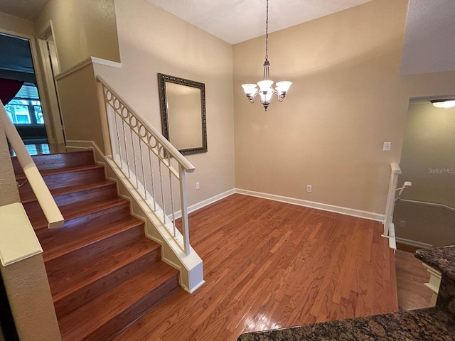 622 Seascape Way, Tampa, FL 33602 - staircase with wood finished floors, a chandelier, and baseboards