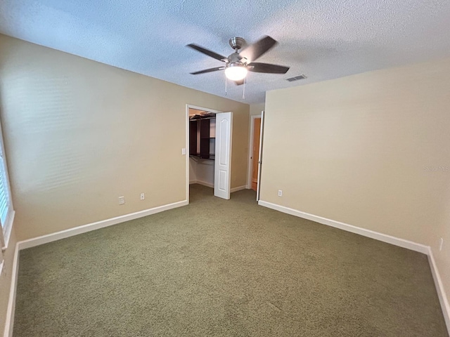 622 Seascape Way, Tampa, FL 33602 - spare room with ceiling fan, baseboards, a textured ceiling, and carpet