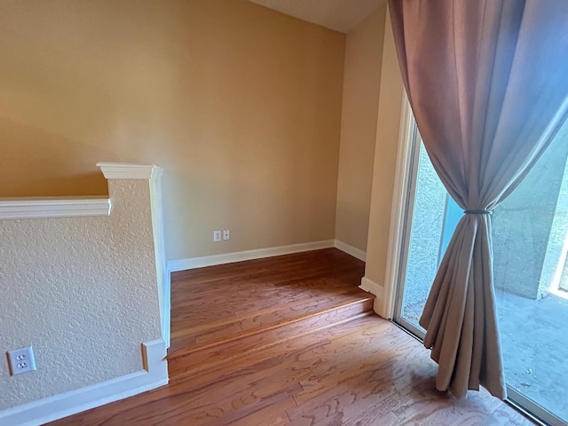 622 Seascape Way, Tampa, FL 33602 - unfurnished room featuring wood finished floors and baseboards