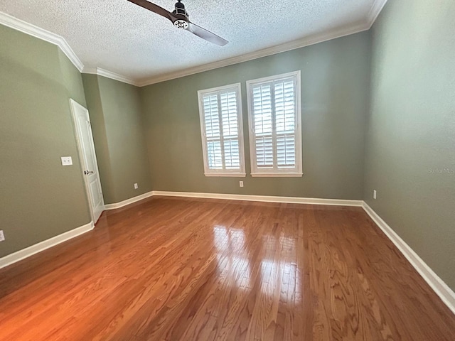 622 Seascape Way, Tampa, FL 33602 - spare room with a ceiling fan, wood finished floors, crown molding, a textured ceiling, and baseboards