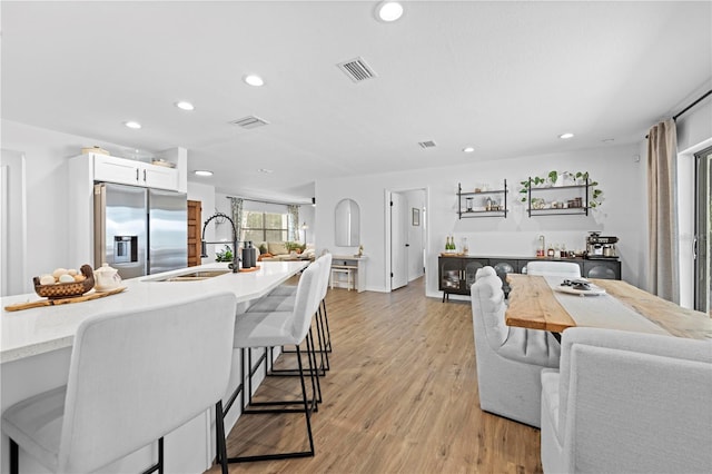 3041 Waterfall Dr, Spring Hill, FL 34608 - dining room featuring recessed lighting and light wood-style floors