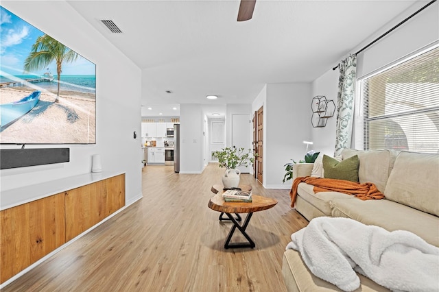 3041 Waterfall Dr, Spring Hill, FL 34608 - living room featuring light wood finished floors, a ceiling fan, baseboards, and recessed lighting