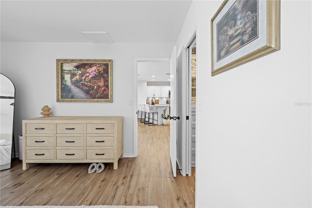 3041 Waterfall Dr, Spring Hill, FL 34608 - hallway featuring light wood finished floors and baseboards