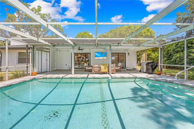 3041 Waterfall Dr, Spring Hill, FL 34608 - outdoor pool with a patio, a lanai, area for grilling, ceiling fan, and outdoor lounge area