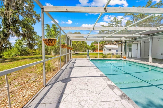 3041 Waterfall Dr, Spring Hill, FL 34608 - swimming pool with a shed, a patio, an outbuilding, and glass enclosure