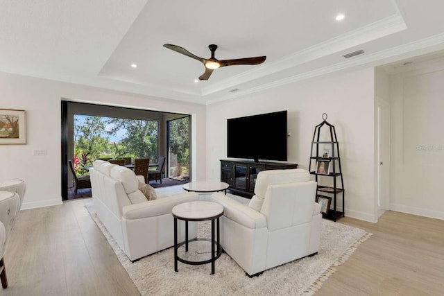 5410 Morey Farms Loop, Palmetto, FL 34221 - living area featuring a raised ceiling, light wood finished floors, baseboards, ceiling fan, and recessed lighting