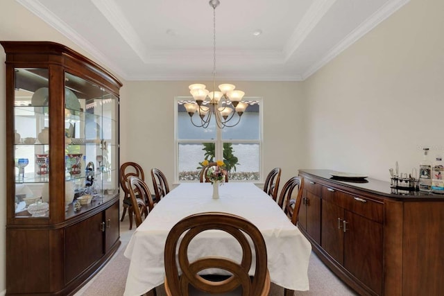 5410 Morey Farms Loop, Palmetto, FL 34221 - dining room with a tray ceiling, a chandelier, light carpet, and crown molding