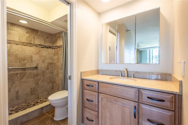 2530 Gary Cir Unit 301, Dunedin, FL 34698 - bathroom with a tile shower, toilet, vanity, and tile patterned flooring