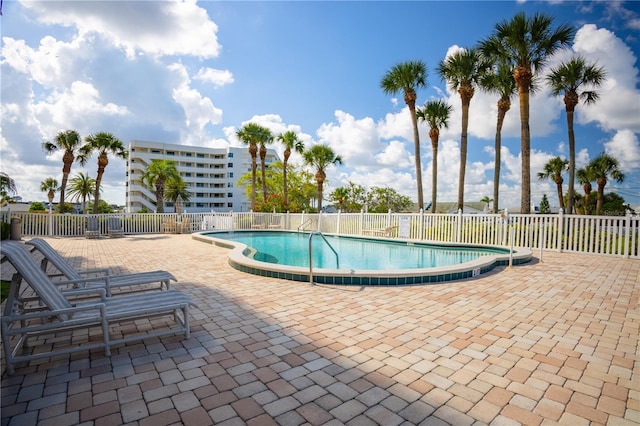 2530 Gary Cir Unit 301, Dunedin, FL 34698 - community pool featuring a patio area and fence