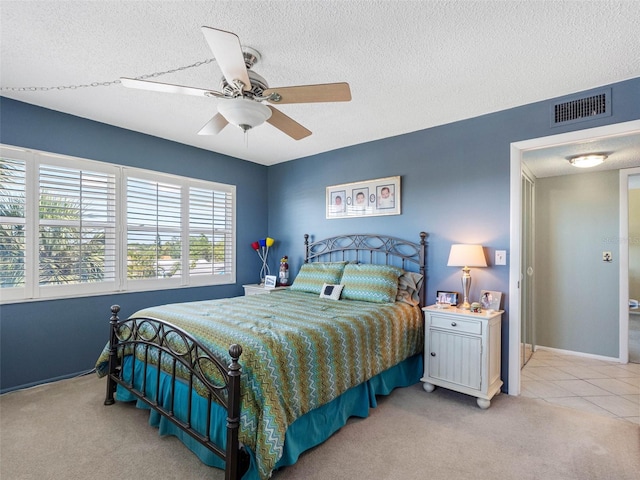 4700 Cove Cir Unit 301, Saint Petersburg, FL 33708 - bedroom featuring carpet, a textured ceiling, ceiling fan, and baseboards