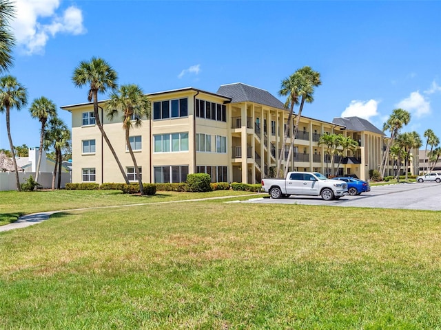 4700 Cove Cir Unit 301, Saint Petersburg, FL 33708 - view of building exterior with uncovered parking