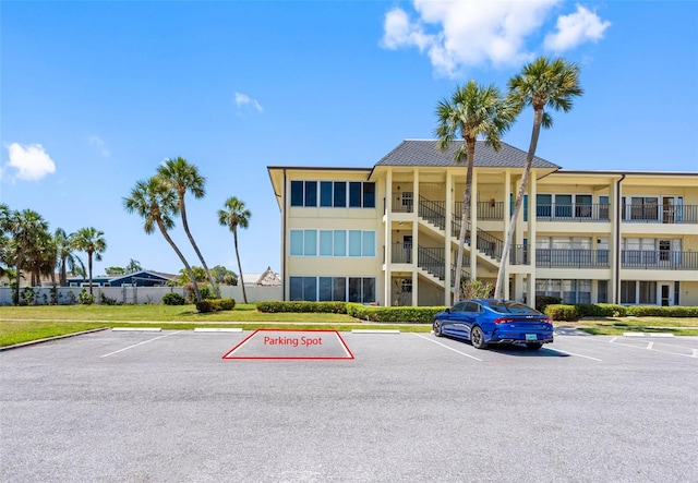 4700 Cove Cir Unit 301, Saint Petersburg, FL 33708 - view of apartment building / complex featuring uncovered parking
