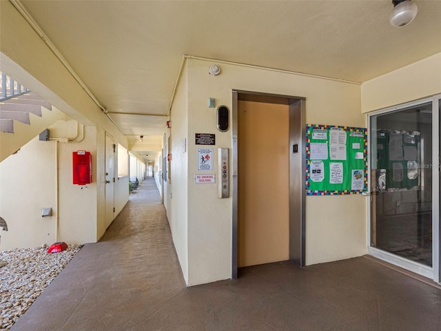 4700 Cove Cir Unit 301, Saint Petersburg, FL 33708 - corridor featuring elevator and stairway
