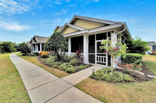 view of front of property with a front lawn and stucco siding