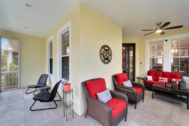view of patio with an outdoor living space and a ceiling fan