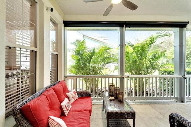 sunroom featuring a ceiling fan and outdoor lounge area
