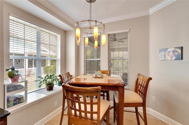 dining area with crown molding, baseboards, and light tile patterned floors