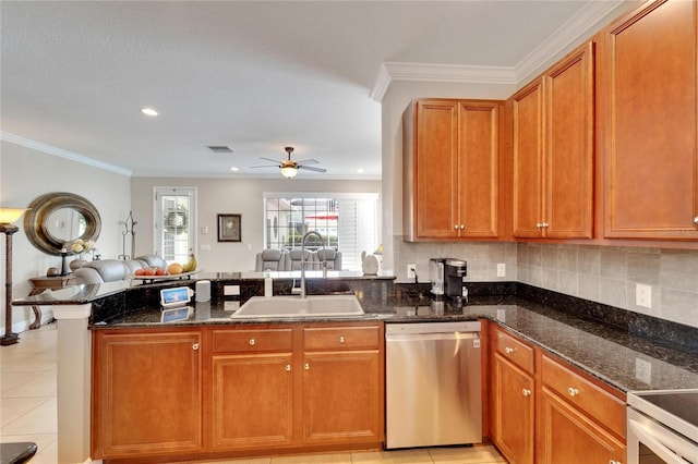 kitchen with dishwasher, a sink, open floor plan, a peninsula, and dark stone countertops