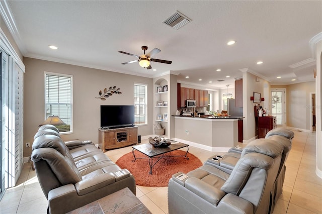 living room with ornamental molding, recessed lighting, light tile patterned floors, a ceiling fan, and built in shelves