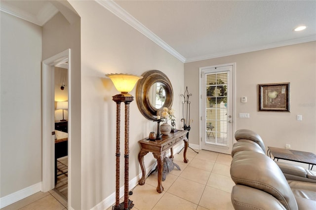 living area featuring crown molding, light tile patterned flooring, baseboards, arched walkways, and recessed lighting