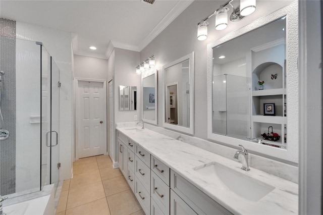 bathroom with ornamental molding, a shower stall, tile patterned flooring, double vanity, and recessed lighting