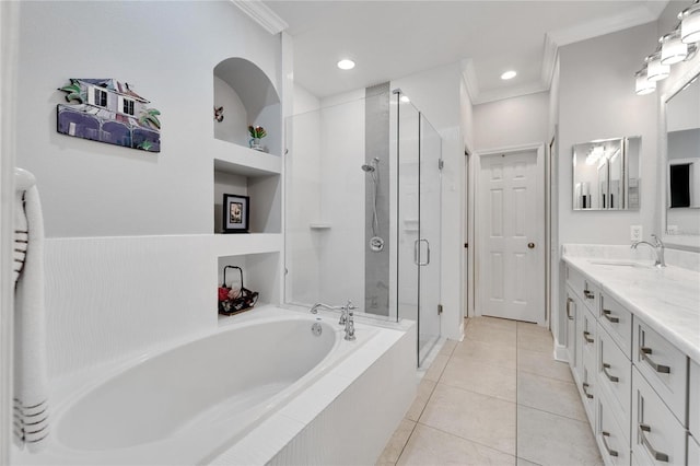 full bath with a garden tub, ornamental molding, a stall shower, tile patterned flooring, and double vanity