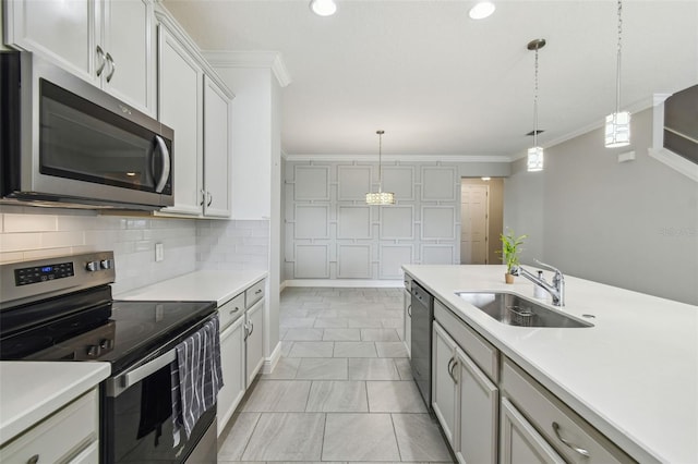 4950 Chase Ct, Saint Cloud, FL 34772 - kitchen featuring appliances with stainless steel finishes, a sink, ornamental molding, light marble finish floors, and light countertops