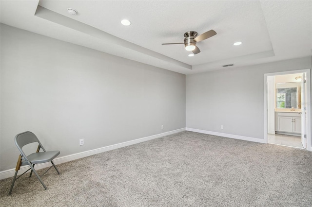 4950 Chase Ct, Saint Cloud, FL 34772 - unfurnished room with a tray ceiling, carpet, baseboards, a ceiling fan, and recessed lighting