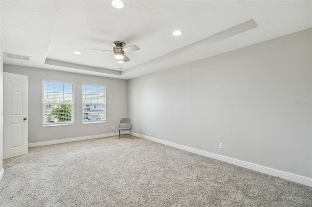 4950 Chase Ct, Saint Cloud, FL 34772 - unfurnished room with a tray ceiling, ceiling fan, carpet, baseboards, and recessed lighting