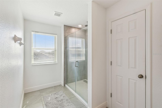 4950 Chase Ct, Saint Cloud, FL 34772 - full bath featuring a stall shower, baseboards, and tile patterned floors