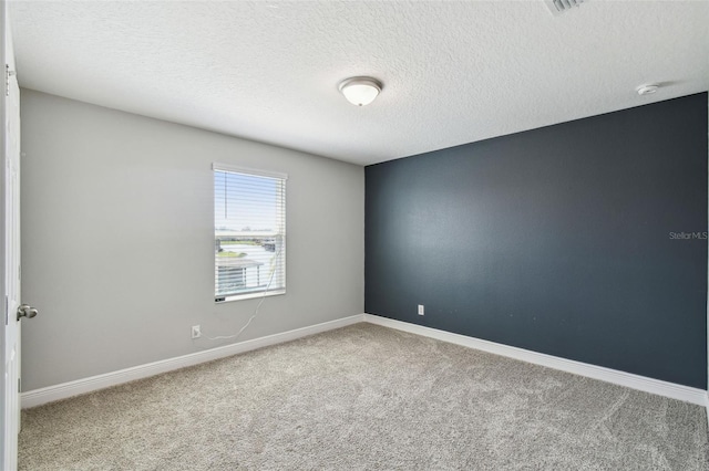 4950 Chase Ct, Saint Cloud, FL 34772 - spare room with carpet, a textured ceiling, baseboards, and a smoke detector