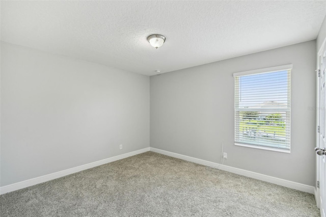 4950 Chase Ct, Saint Cloud, FL 34772 - carpeted spare room featuring a textured ceiling and baseboards