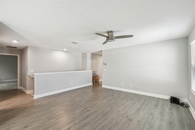 4950 Chase Ct, Saint Cloud, FL 34772 - unfurnished room with a ceiling fan, wood finished floors, baseboards, and recessed lighting